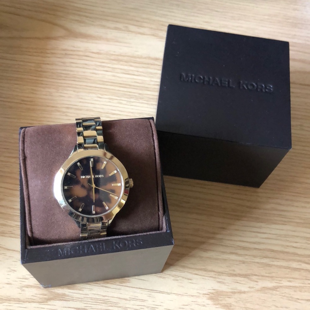 Michael Kors gold watch with tortious face